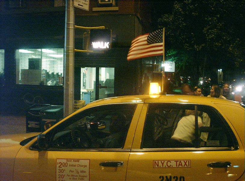 NYC taxi flying American flag