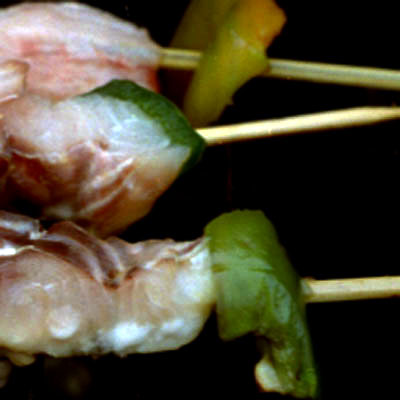 photograph of raw squid en brochette at New York City street fair