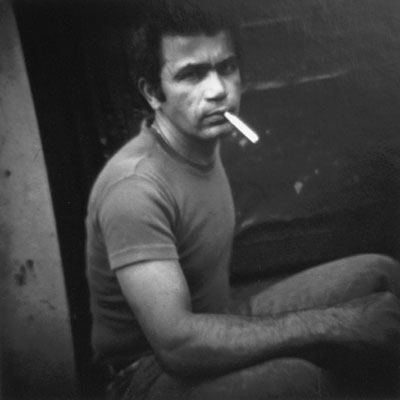 man smoking on a New York City stoop in 1983